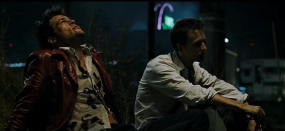 Film still of two men sitting outside at night, used as a mood reference.